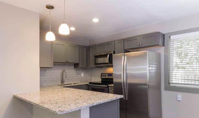 Kitchen with fridge and microwave